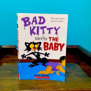 Bad kitty meets the baby